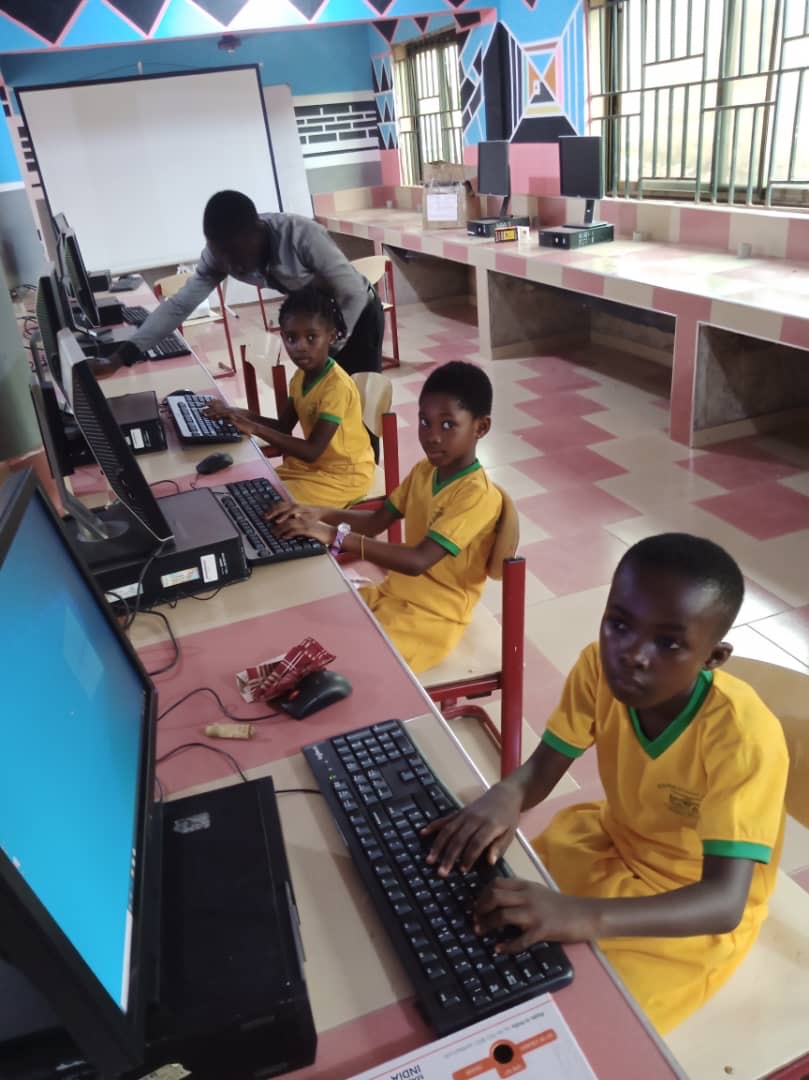 Primary pupils learning to type at the IBS ICT lab